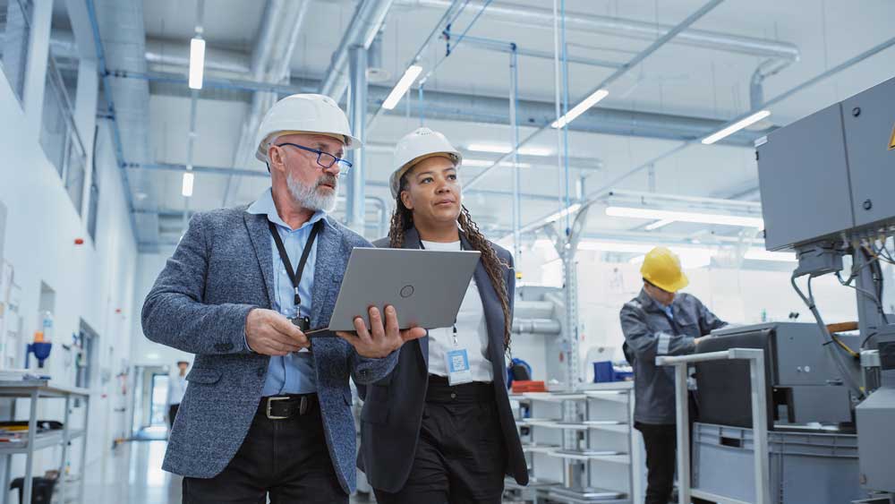 Two workers wearing hard hats.