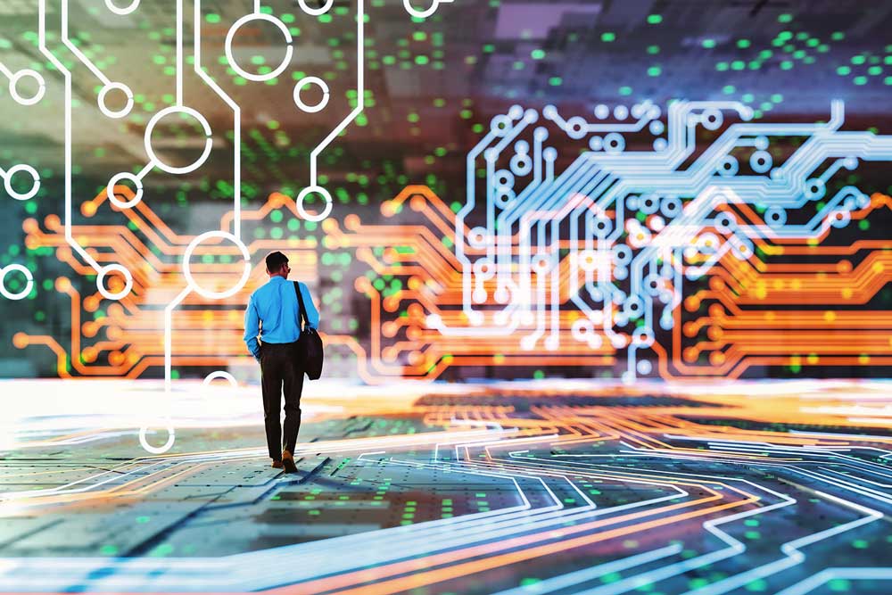 A man in front of a circuit board, representing the fusion of artificial intelligence and business expertise.